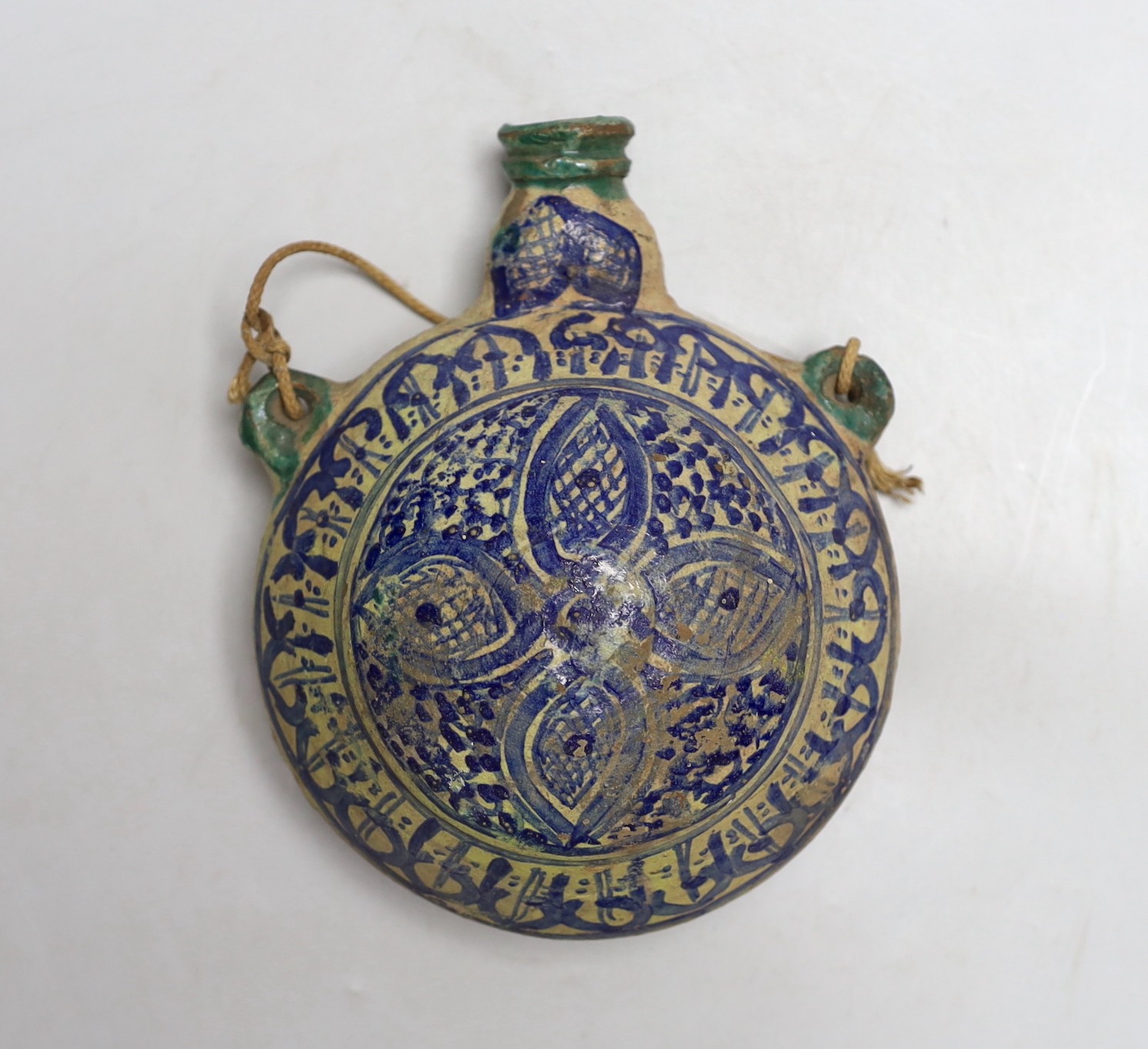 A late 19th century Moroccan pottery flask, 19cms high
